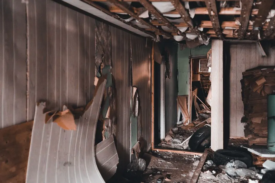 Explore the chaos of an abandoned building with this striking image of a derelict interior, capturing its decay and destruction.